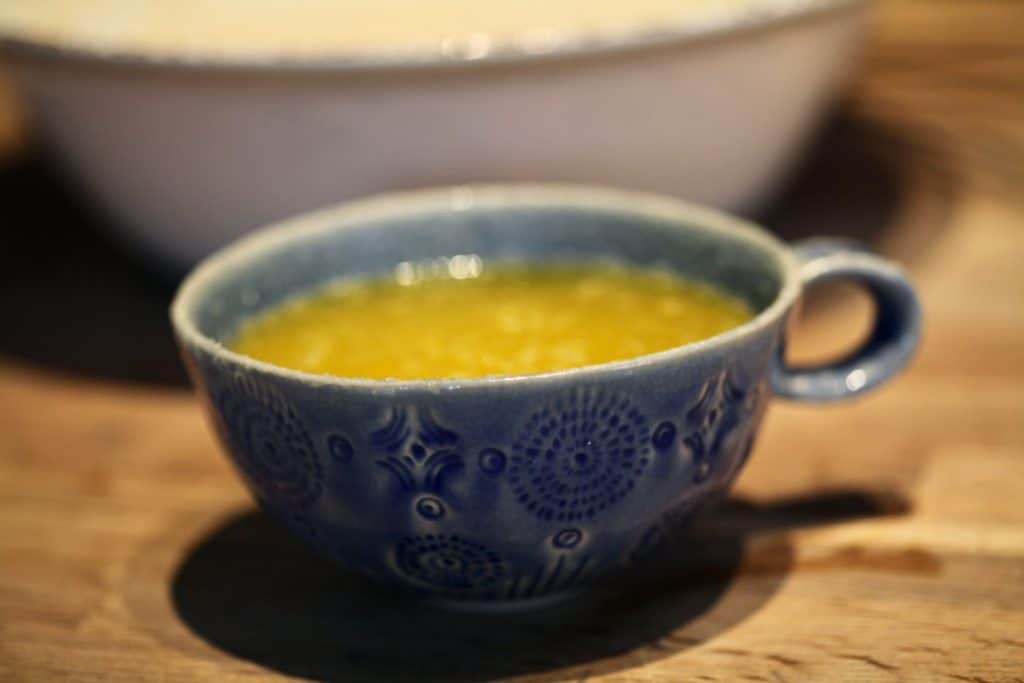 blue mug with melted butter mixture