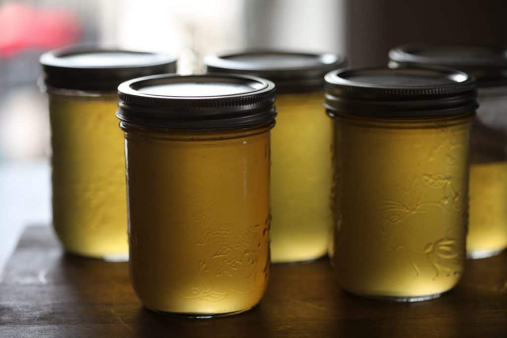 yellow dandelion jelly in mason jars