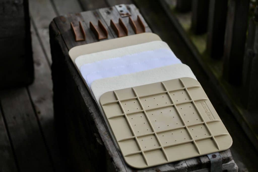 microwave flower press opened up on a grey wooden box