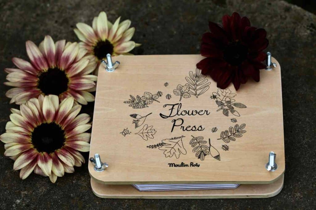 wooden flower press decorated with sunflowers of different colours