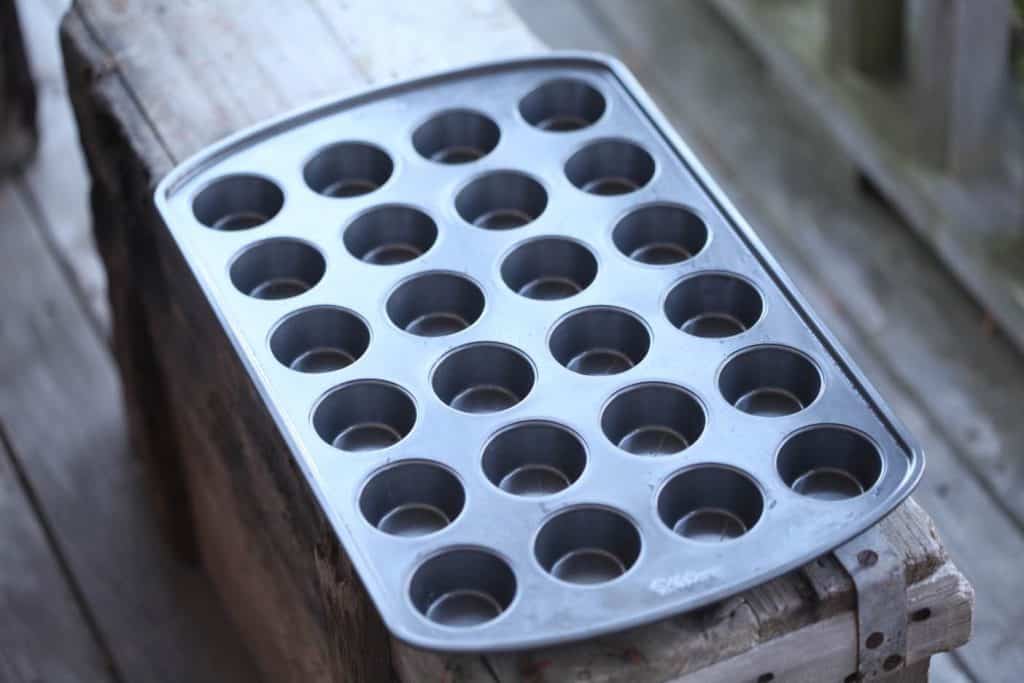 mini muffin tin on a wooden crate