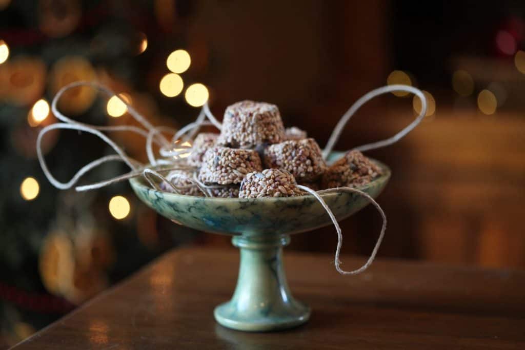 birdseed ornaments in a green alabaster bowl