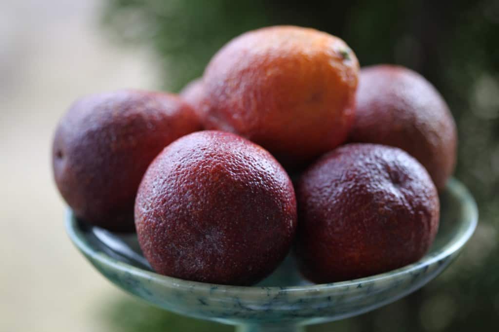 blood oranges on a green platter