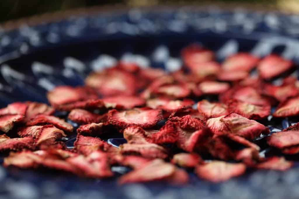 dehydrated strawberries on a blue platter 