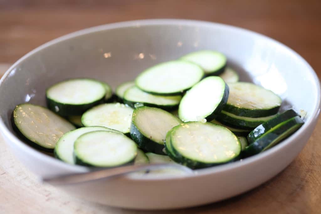 mix well coating the zucchini with oil