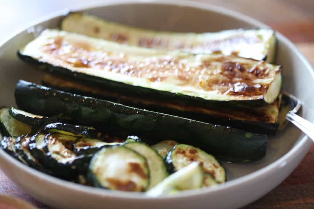 air fryer zucchini in a white bowl