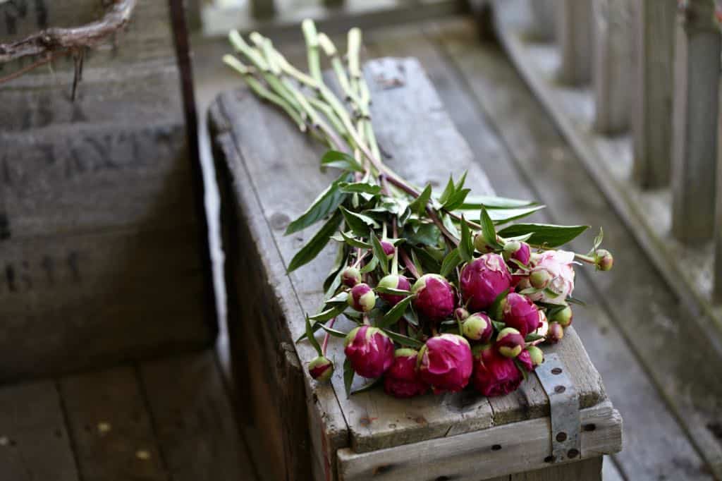 a peony bouquet on a wooden box