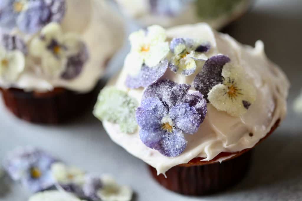 cupcakes decorated with edible candied flowers