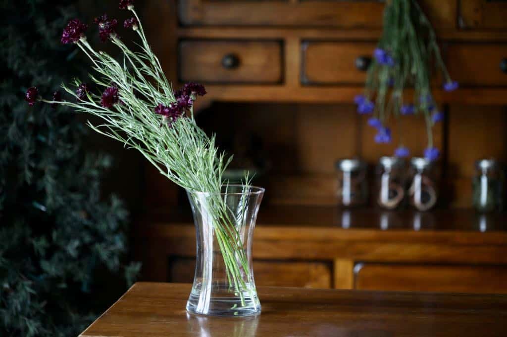 air drying bachelor buttons in a vase