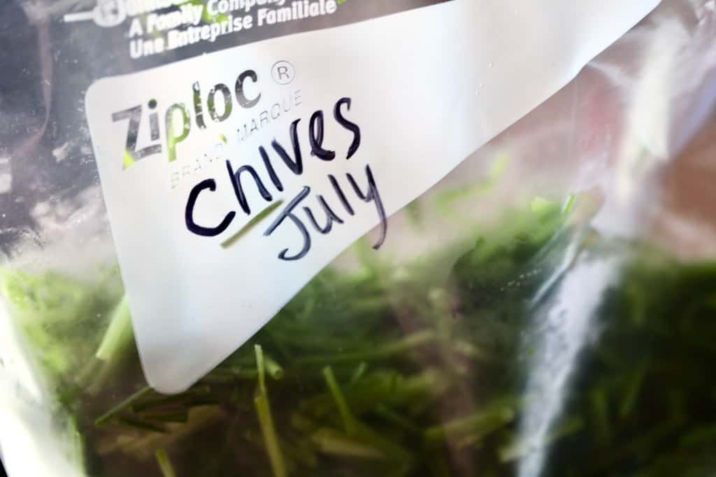 a ziplock bag full of frozen chives