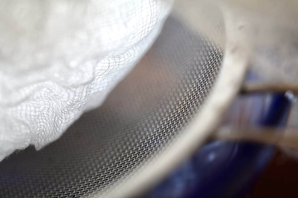 a fine mesh sieve, covered with cheesecloth for straining the rose hips, and removing the irritating hairs and seeds