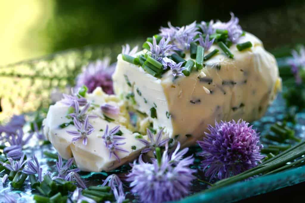 chive butter garnished with chive petals and flowers