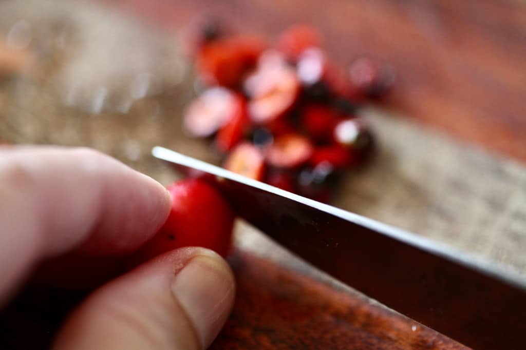 removing the rose hip stems and blossom ends with a knife