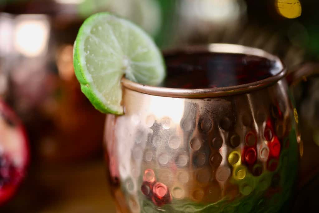 a copper cup with a lime slice garnish