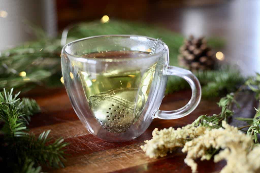goldenrod tea in a glass mug