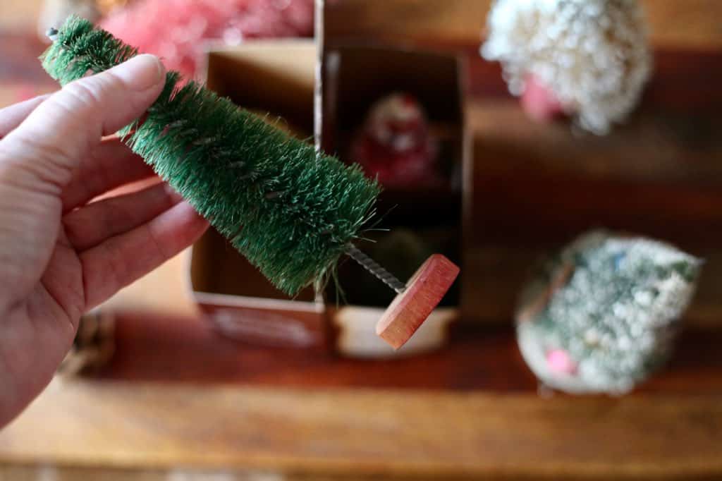 storing bottle brush trees in a pop bottle caddy