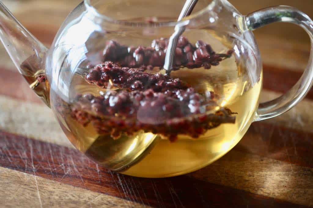sumac berries infusing in a teapot