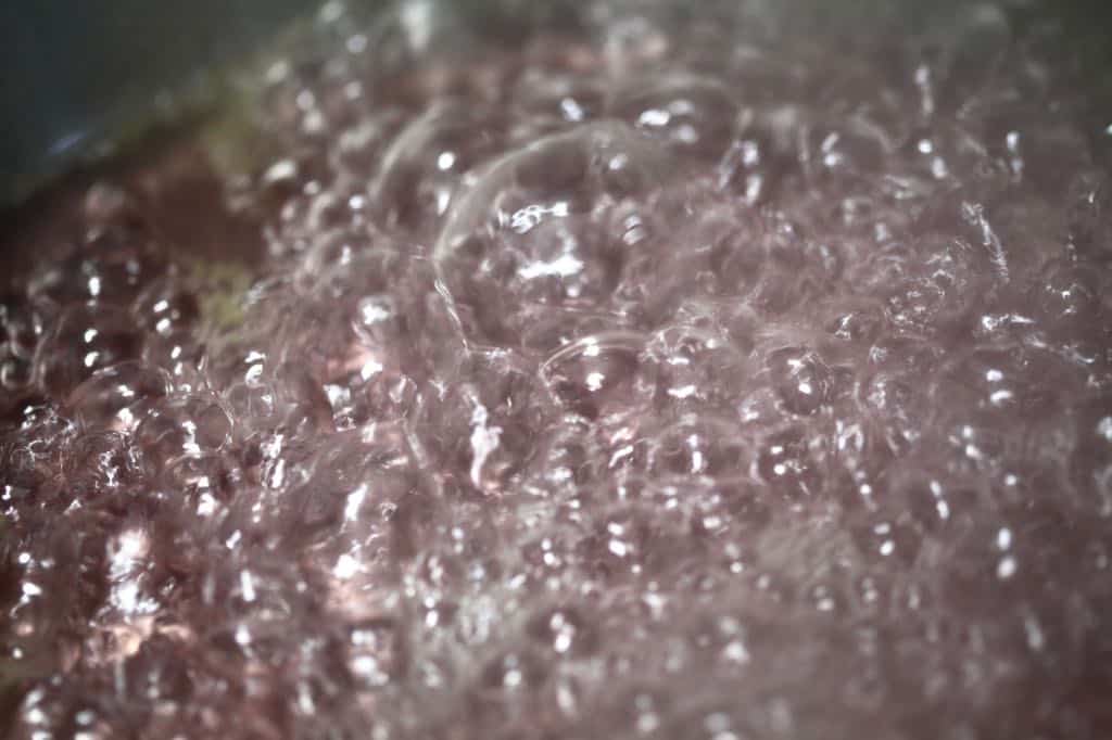 pink bubbles of boiling juice