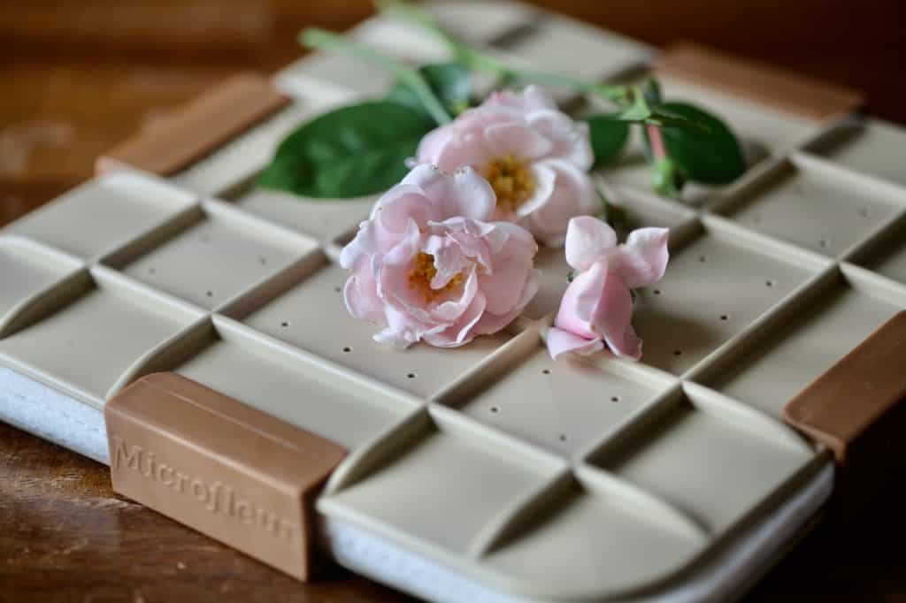 a microwave flower press with roses on top