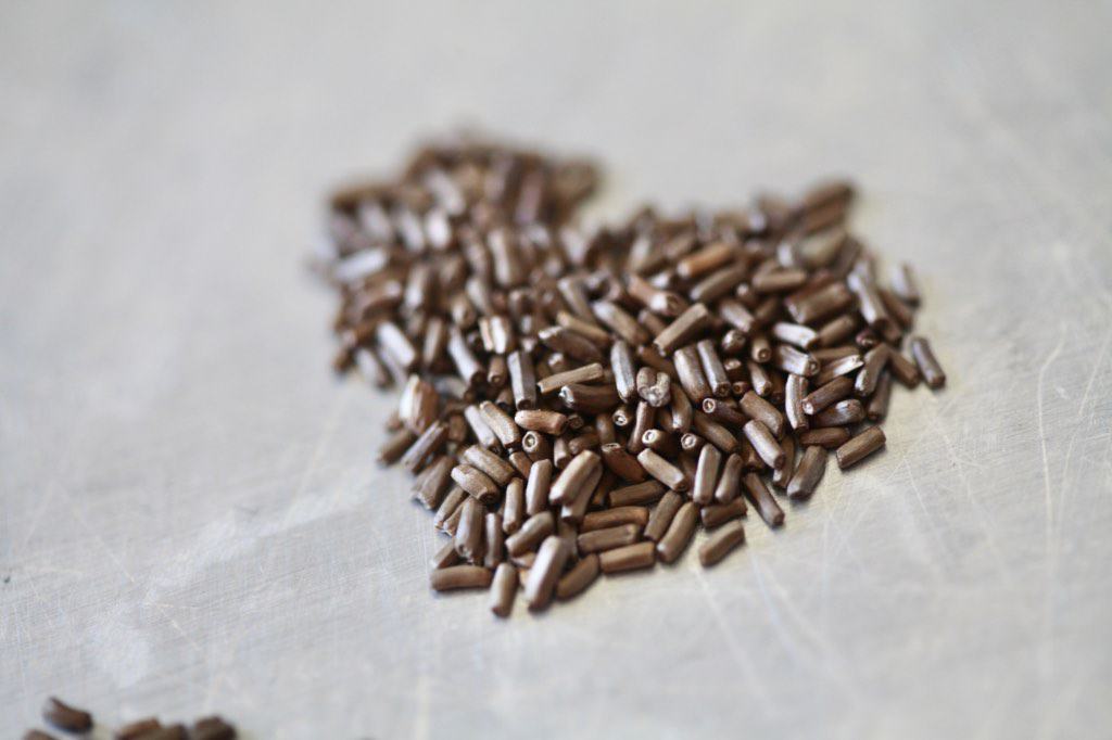 strawflower seeds piled in the shape of a heart