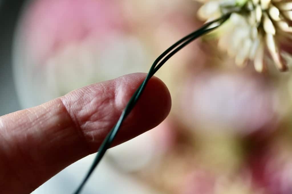 secure the wired flower stem by wrapping the wires together