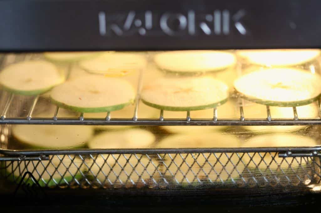 sliced pears dehydrating in an air fryer