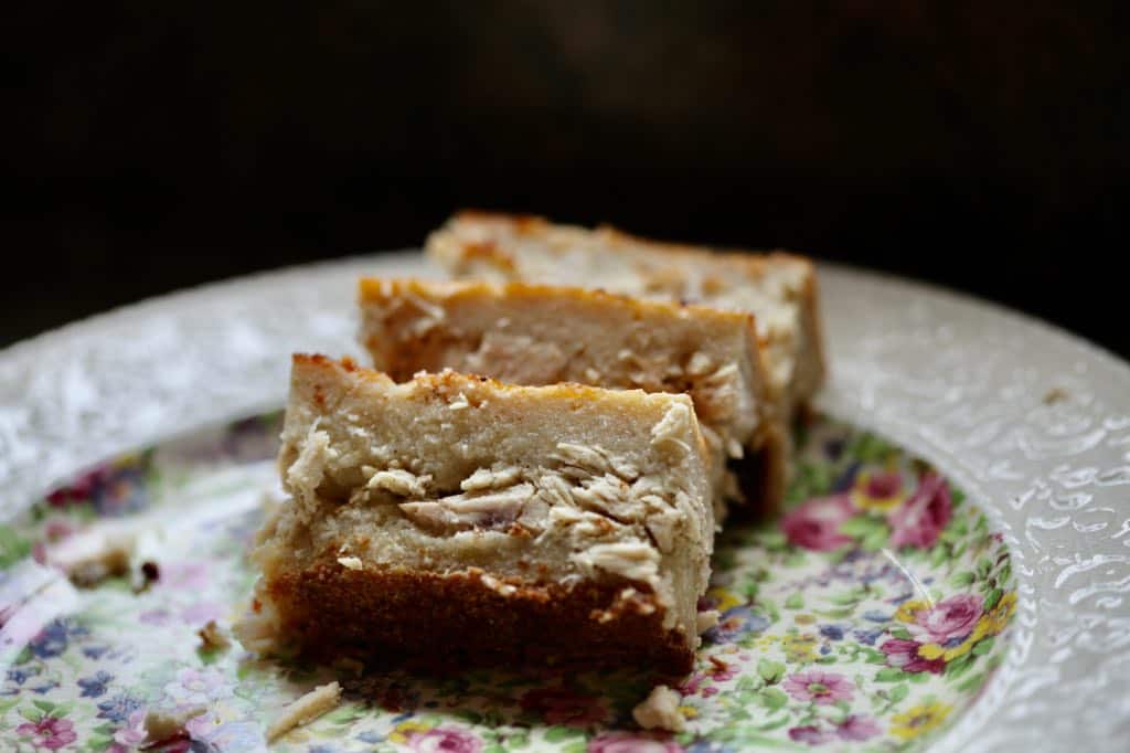 pieces of cassava pie on a floral china plate