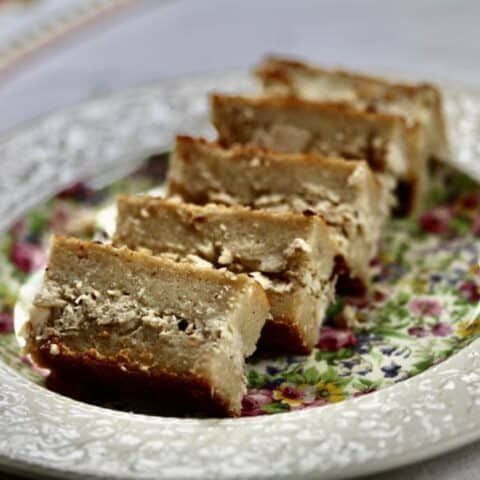 five pieces of cassava pie on a plate